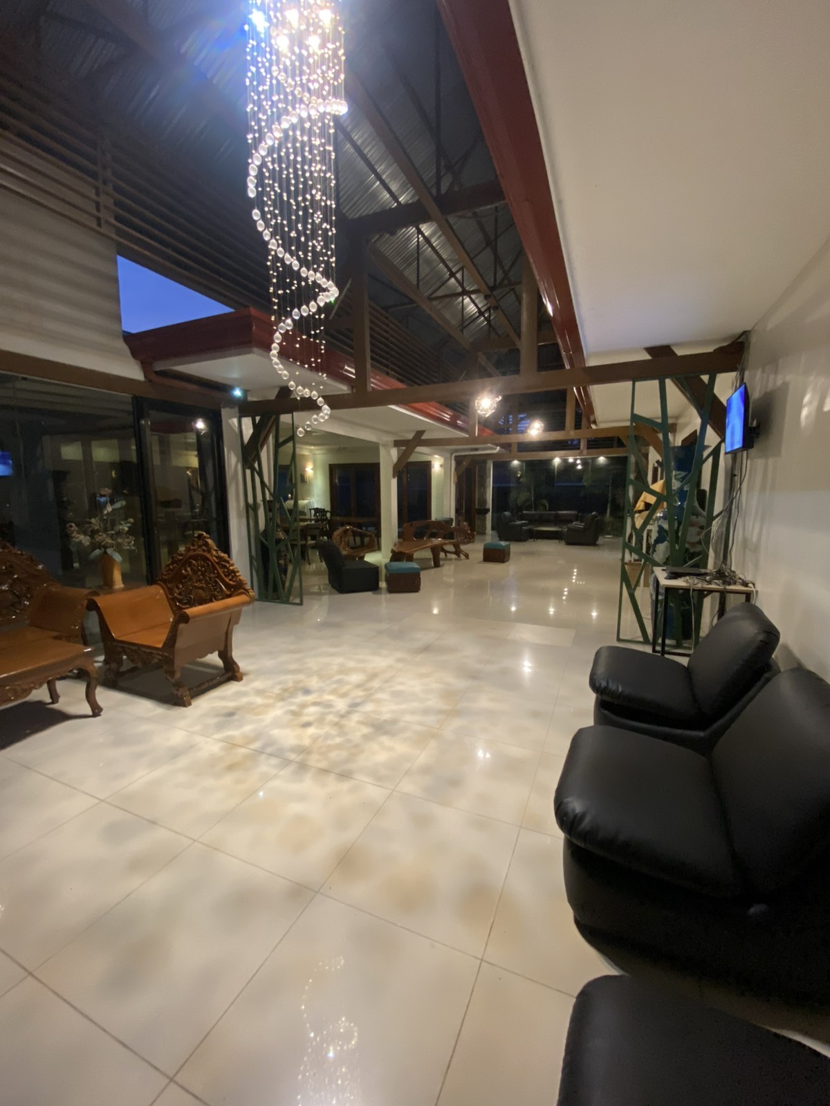 Elegant main lounge area with stunning crystal chandelier and comfortable seating